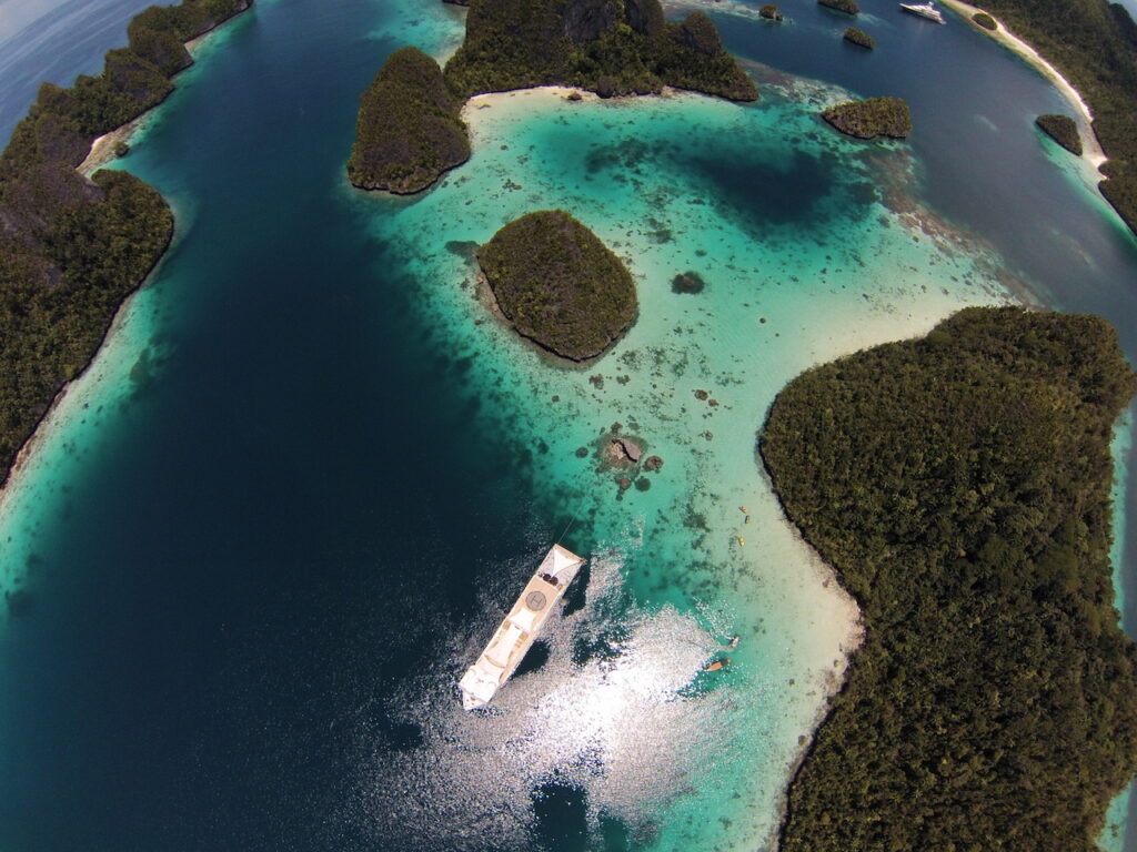 Aireal photo of a superyacht stern-to in Wayag, Raja Ampat, Indonesia