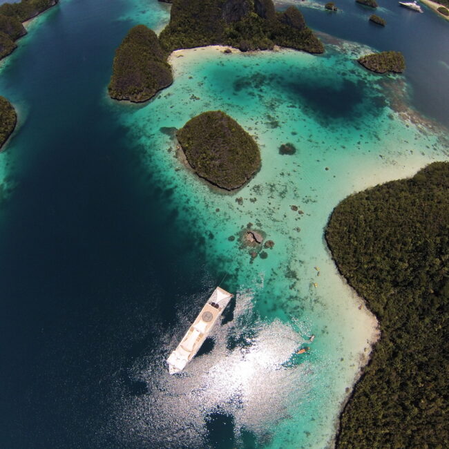 Aireal photo of a superyacht stern-to in Wayag, Raja Ampat, Indonesia